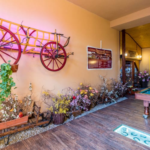 a room with a table and a bench with a bicycle on it