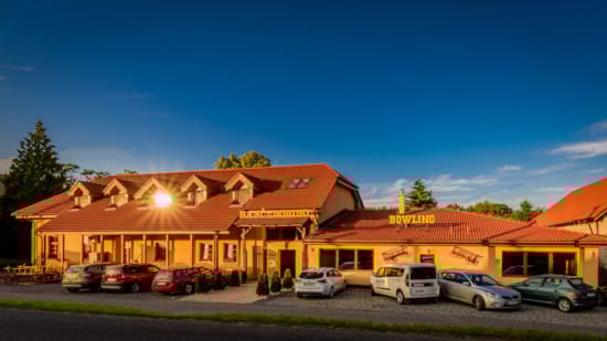 a building with cars parked in front