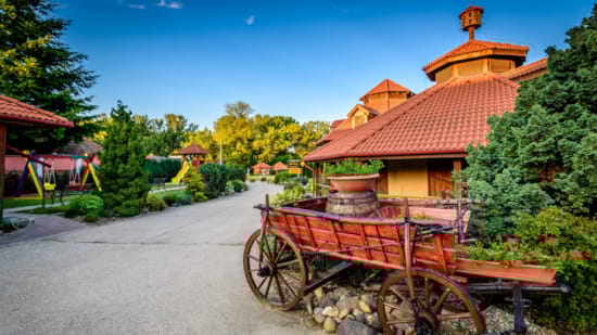 a wooden building with a red roof