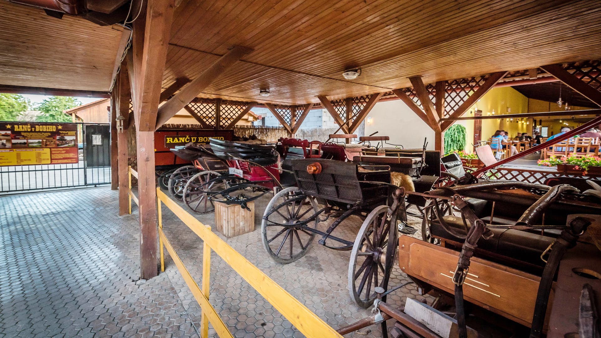 a group of bicycles parked in a covered area
