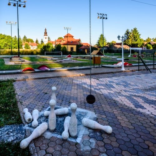 a brick road with a fountain