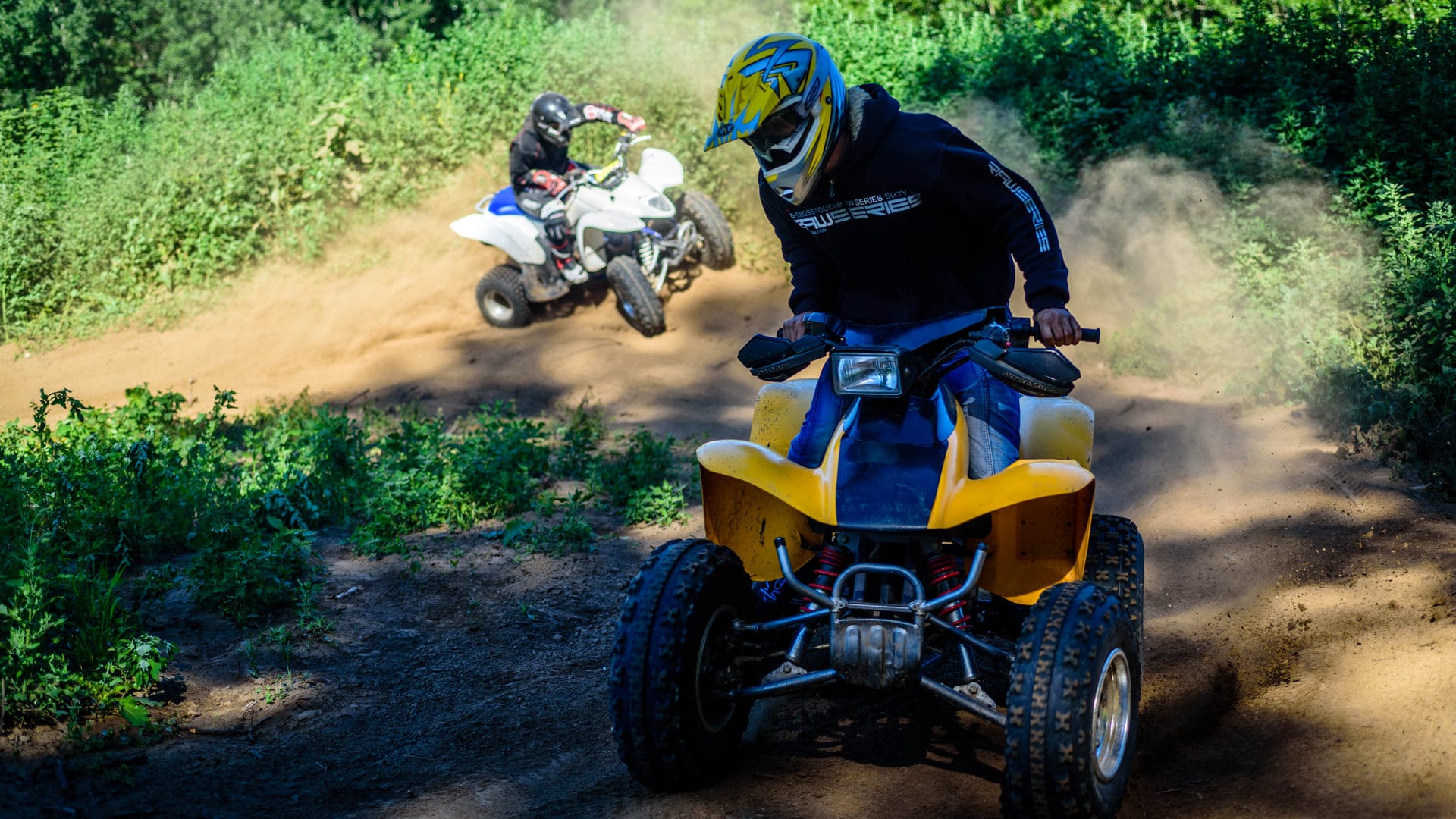 a group of people riding on dirt bikes