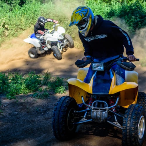 a group of people riding on dirt bikes