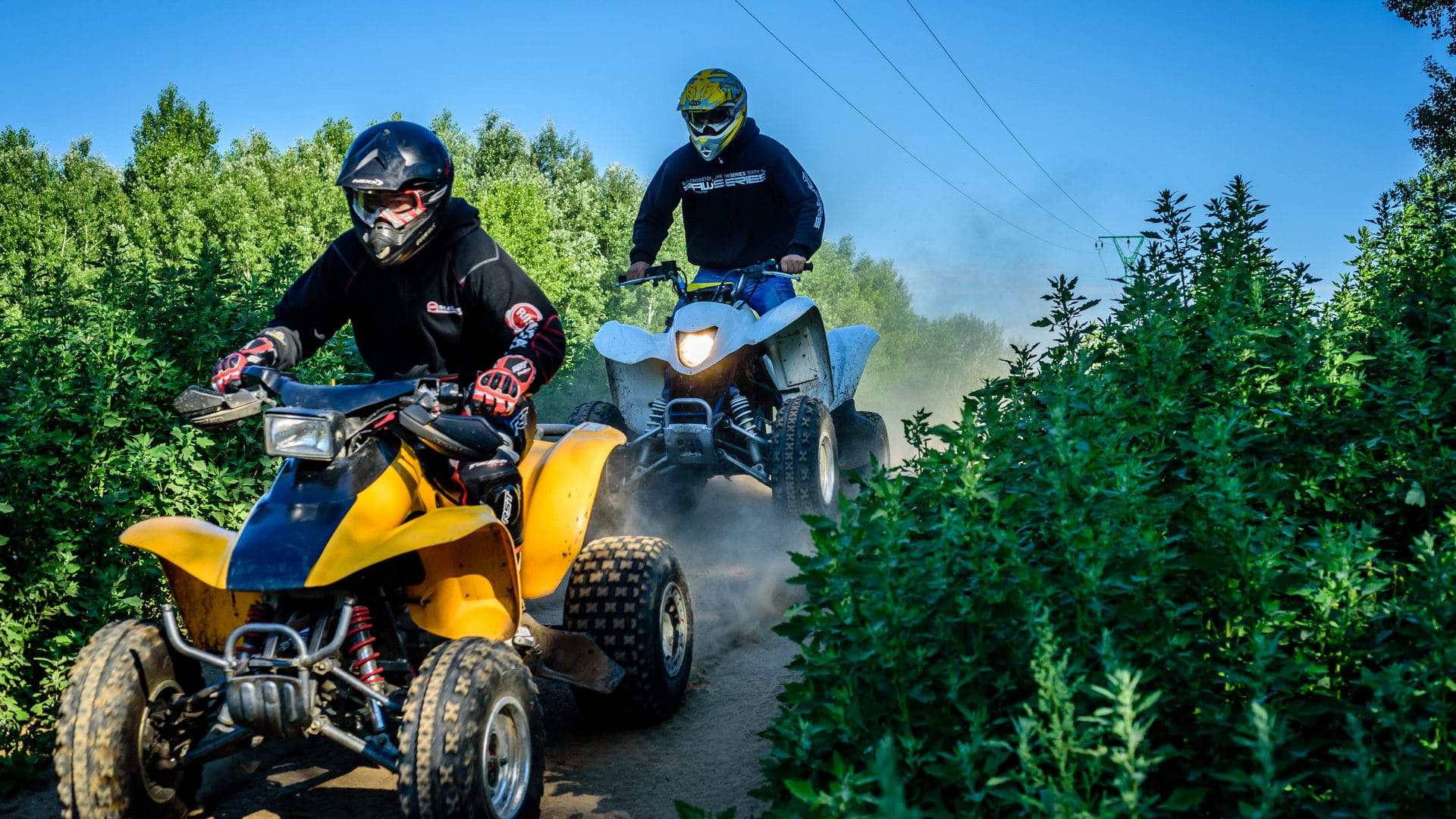 two people riding on two wheelers