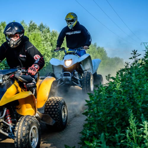 two people riding on two wheelers