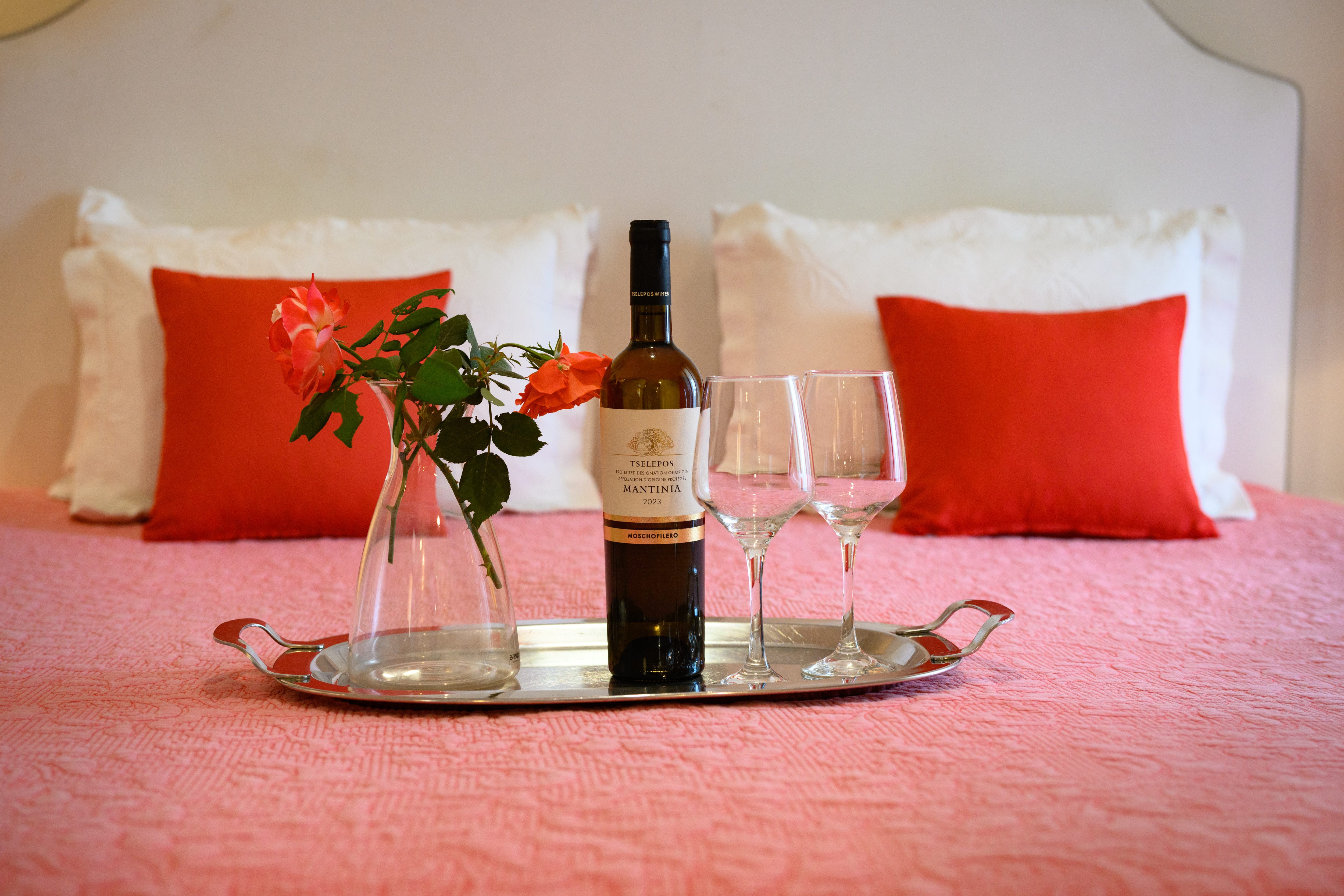 a bottle of wine and glasses on a table