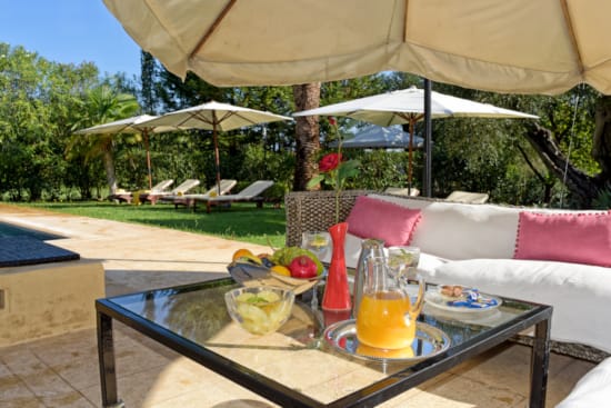 a table with a glass of orange juice and a glass of orange juice