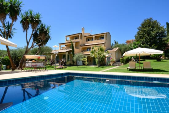a swimming pool in front of a house