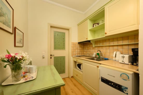 a kitchen with white cabinets