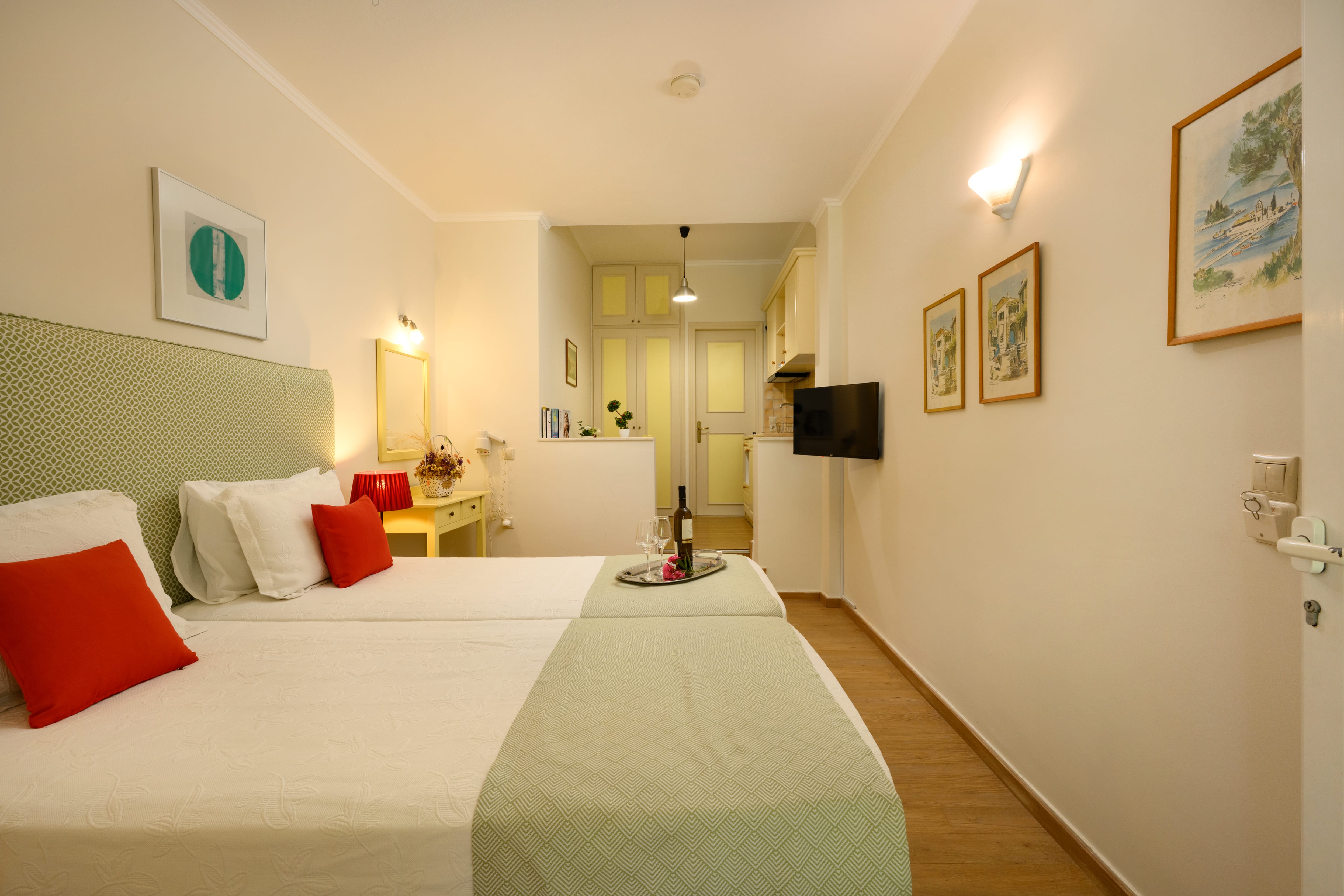 a hotel room with a bed and a tv