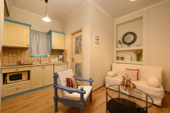 a living room with a table and chairs