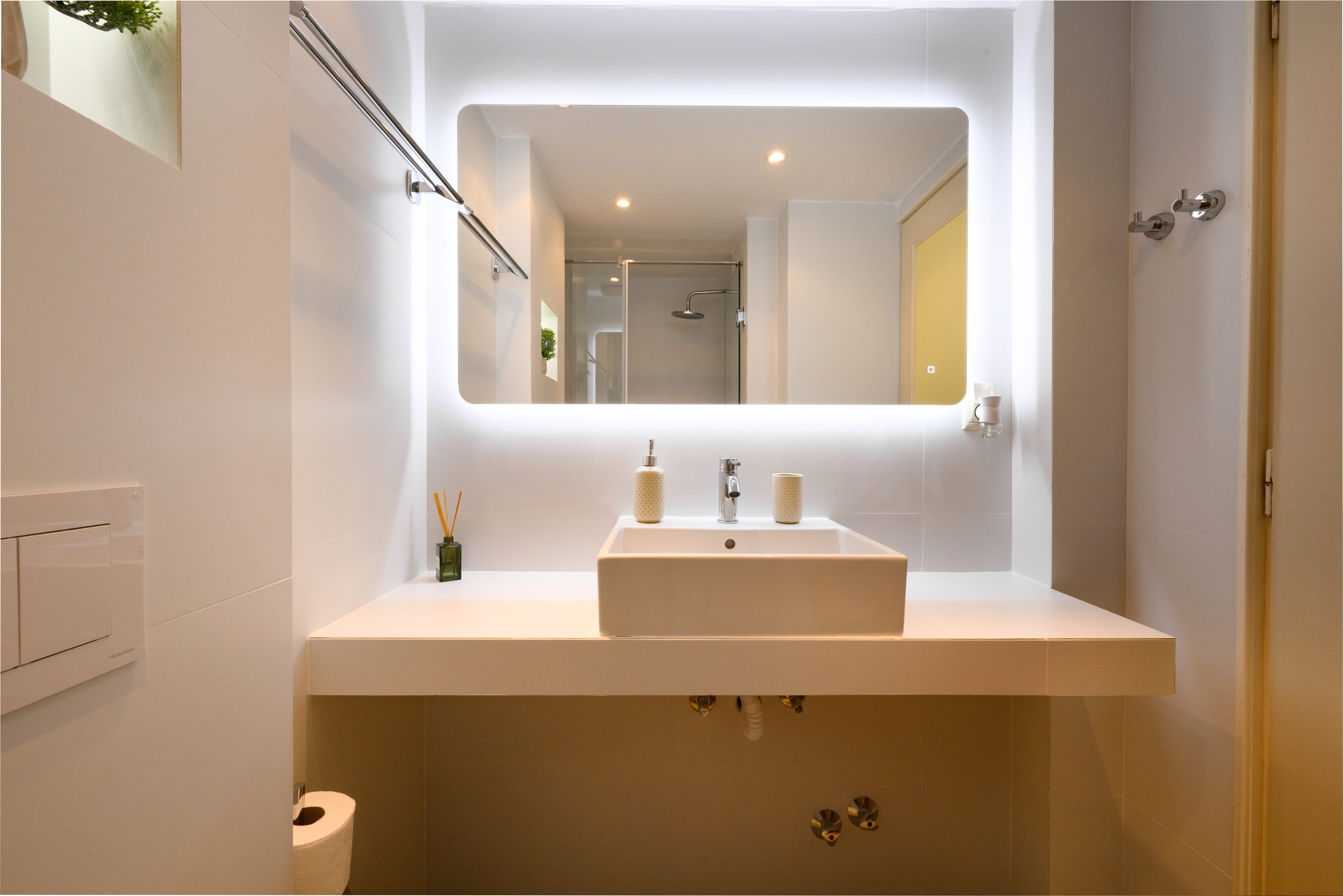 a bathroom with a large mirror