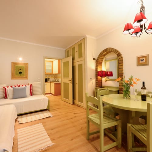 a living room with a table and chairs