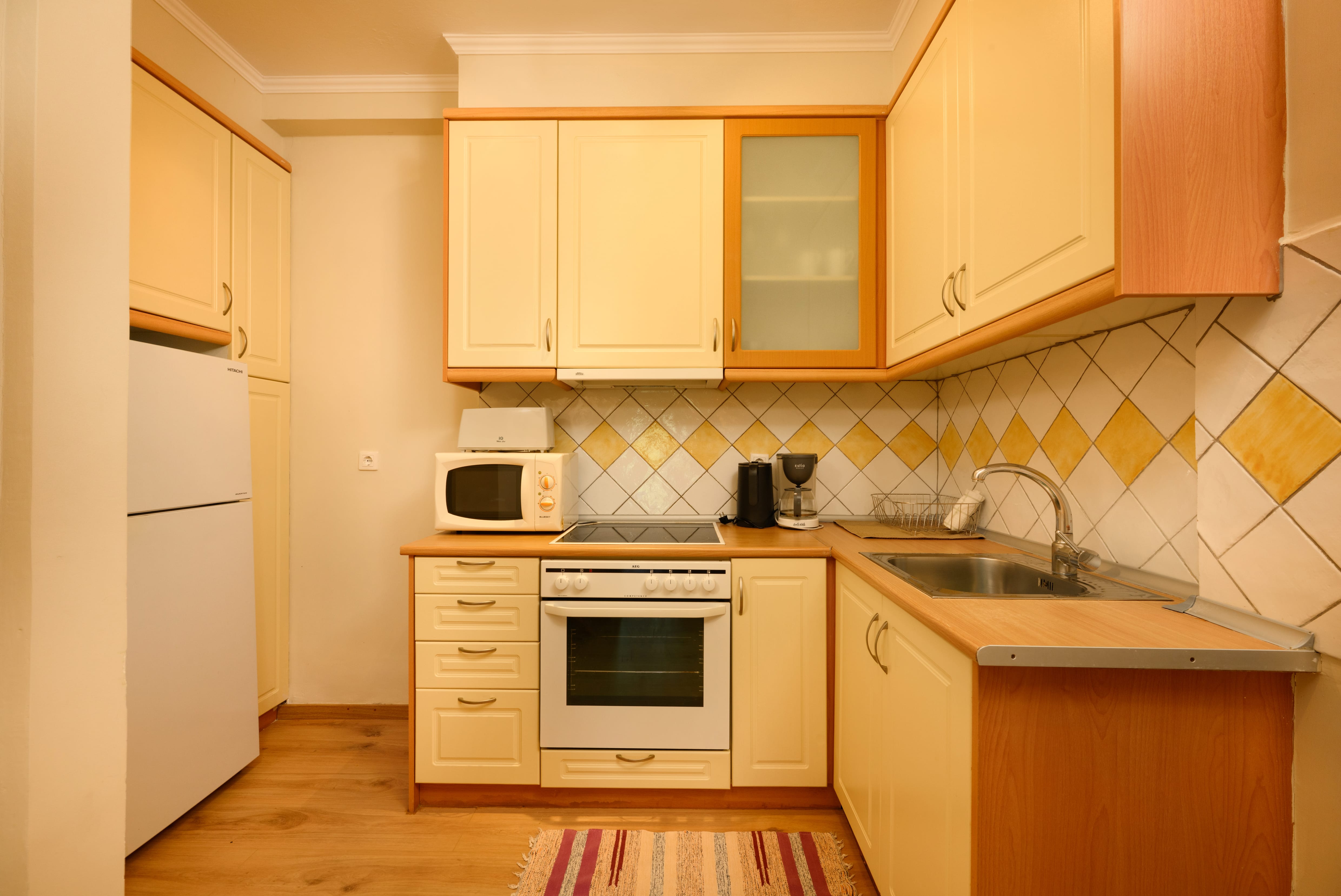 a kitchen with white cabinets