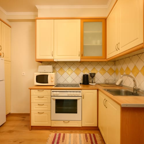 a kitchen with white cabinets