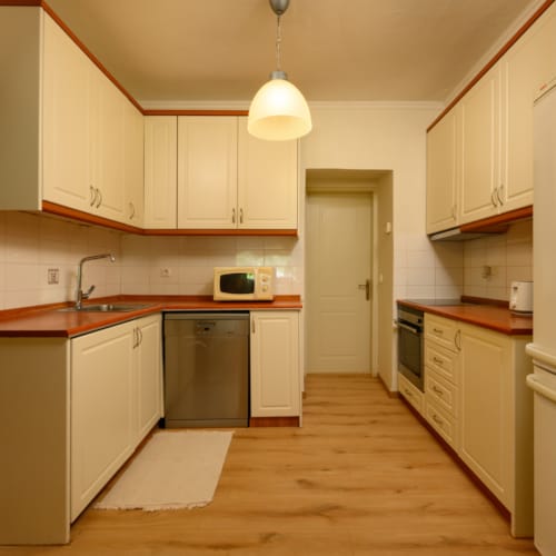 a kitchen with white cabinets