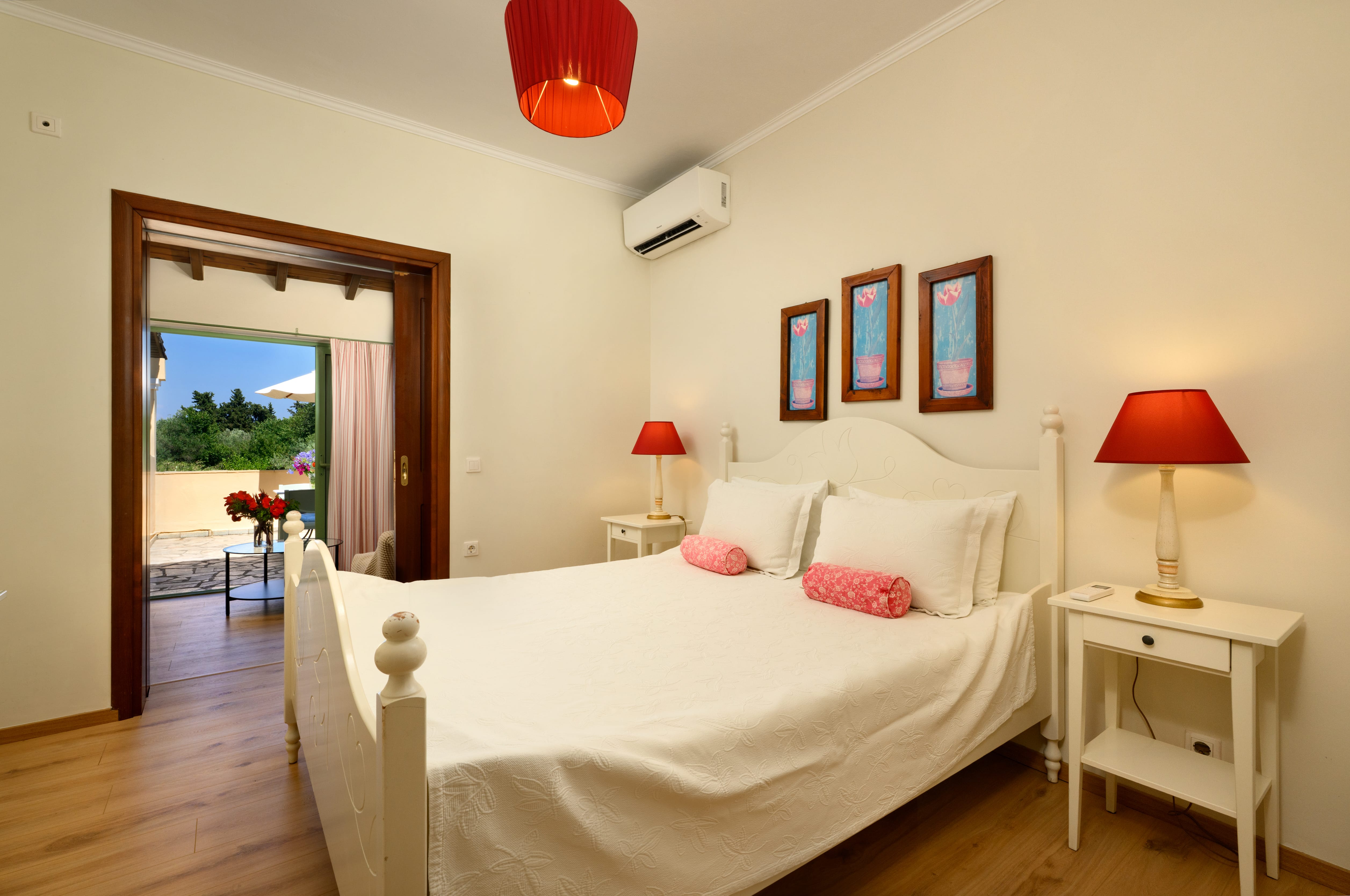 a bedroom with a bed and lamps