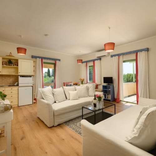 a living room with white couches