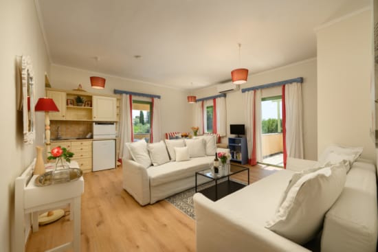 a living room with white couches