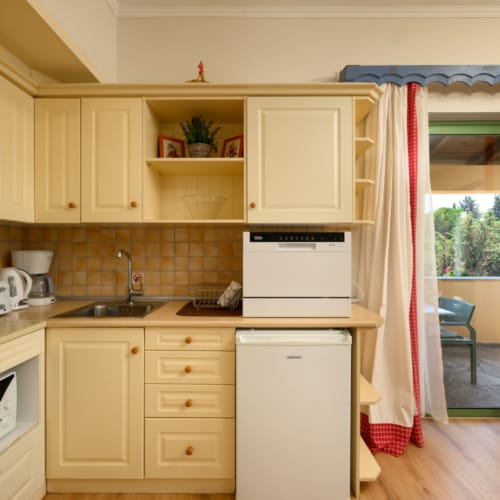 a kitchen with white cabinets