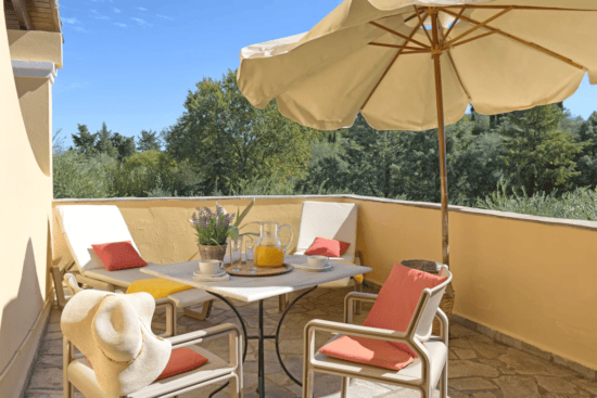 a table and chairs on a deck