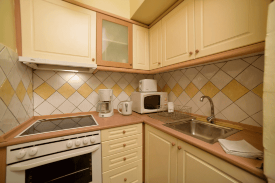 a kitchen with white cabinets