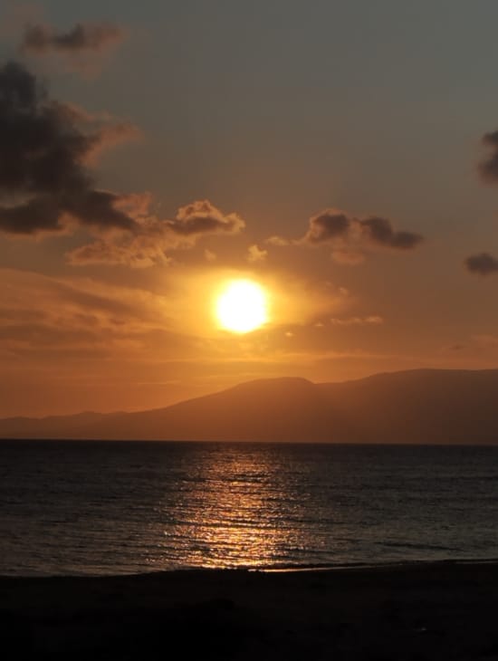 a sunset over a body of water