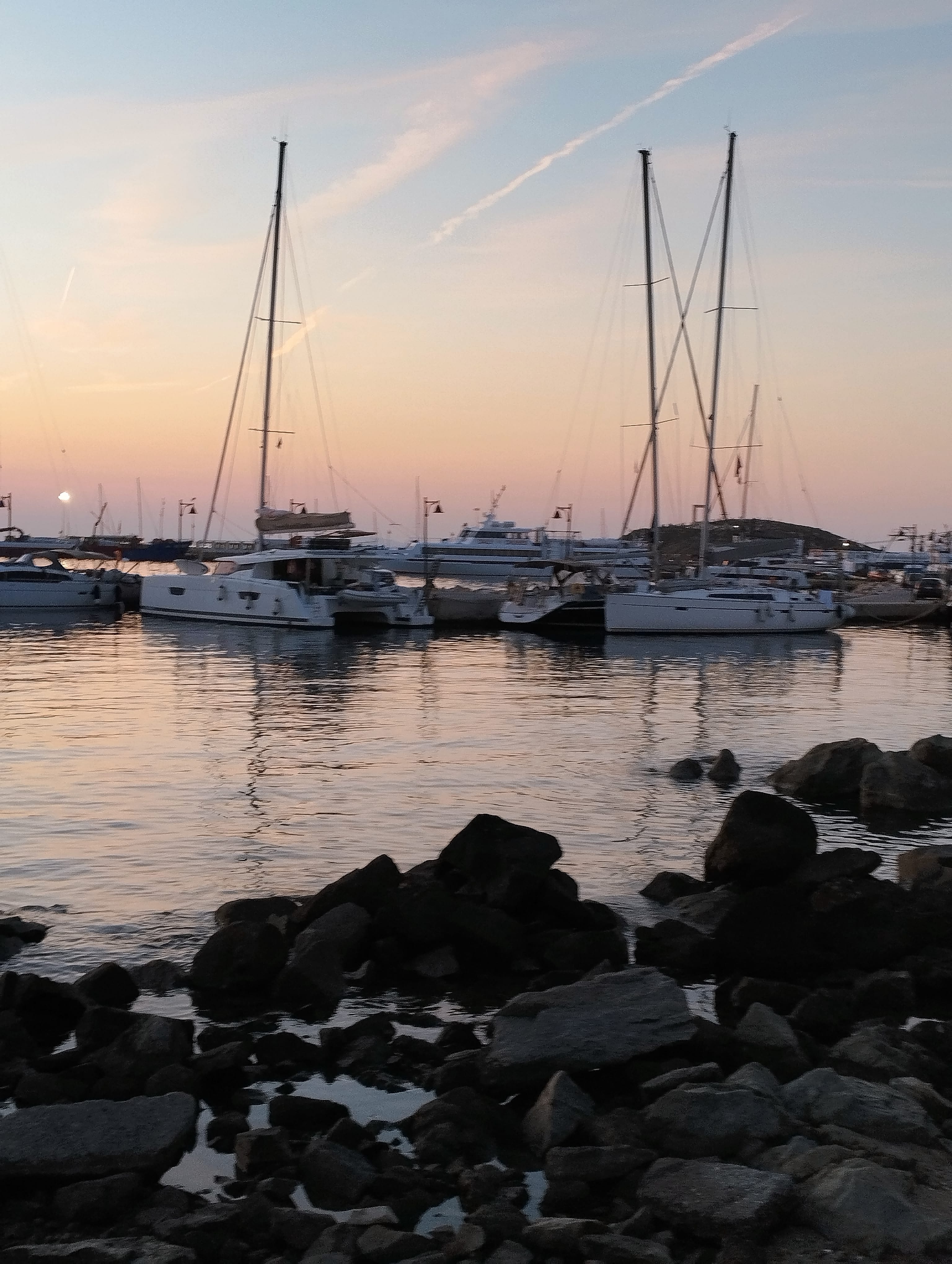 a group of boats in a harbor