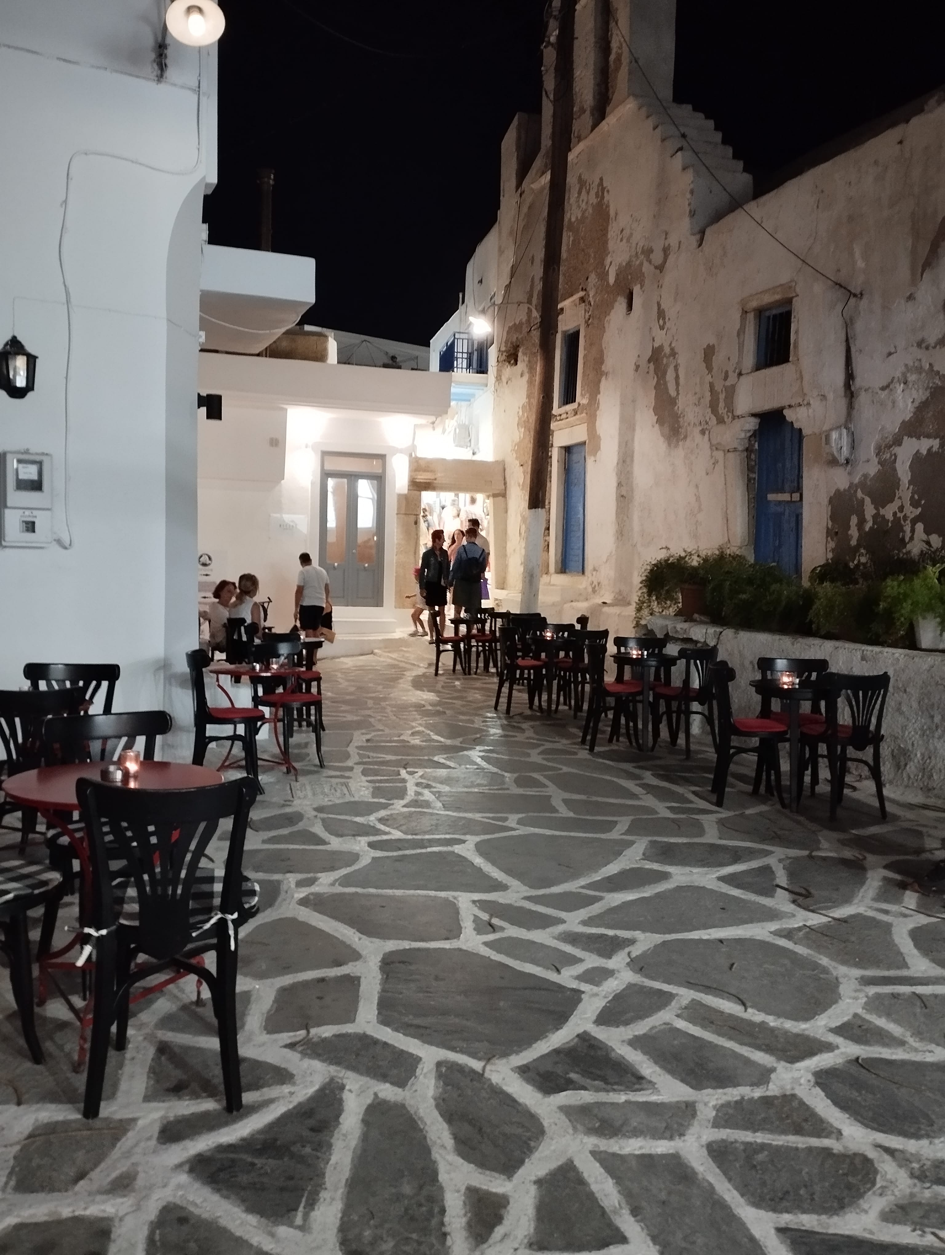 a courtyard with tables and chairs