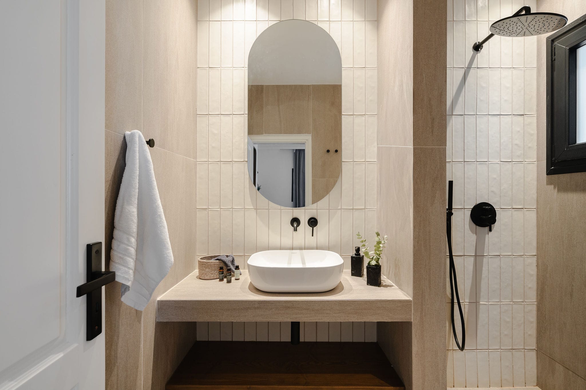 a bathroom with a round mirror