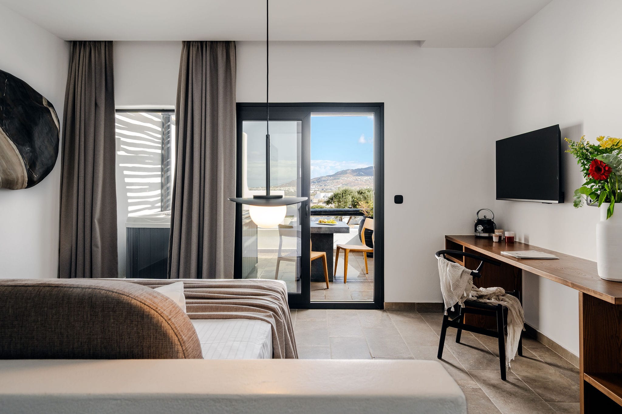 a room with a bed and a tv