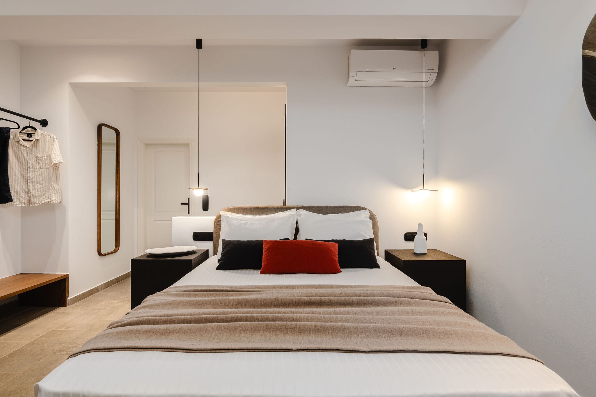 a bed with red pillows