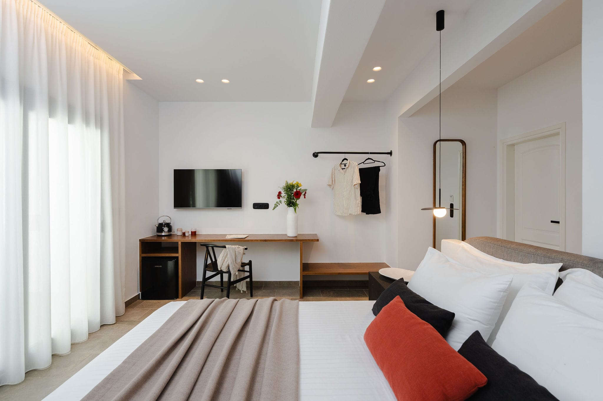 a room with a bed and a desk