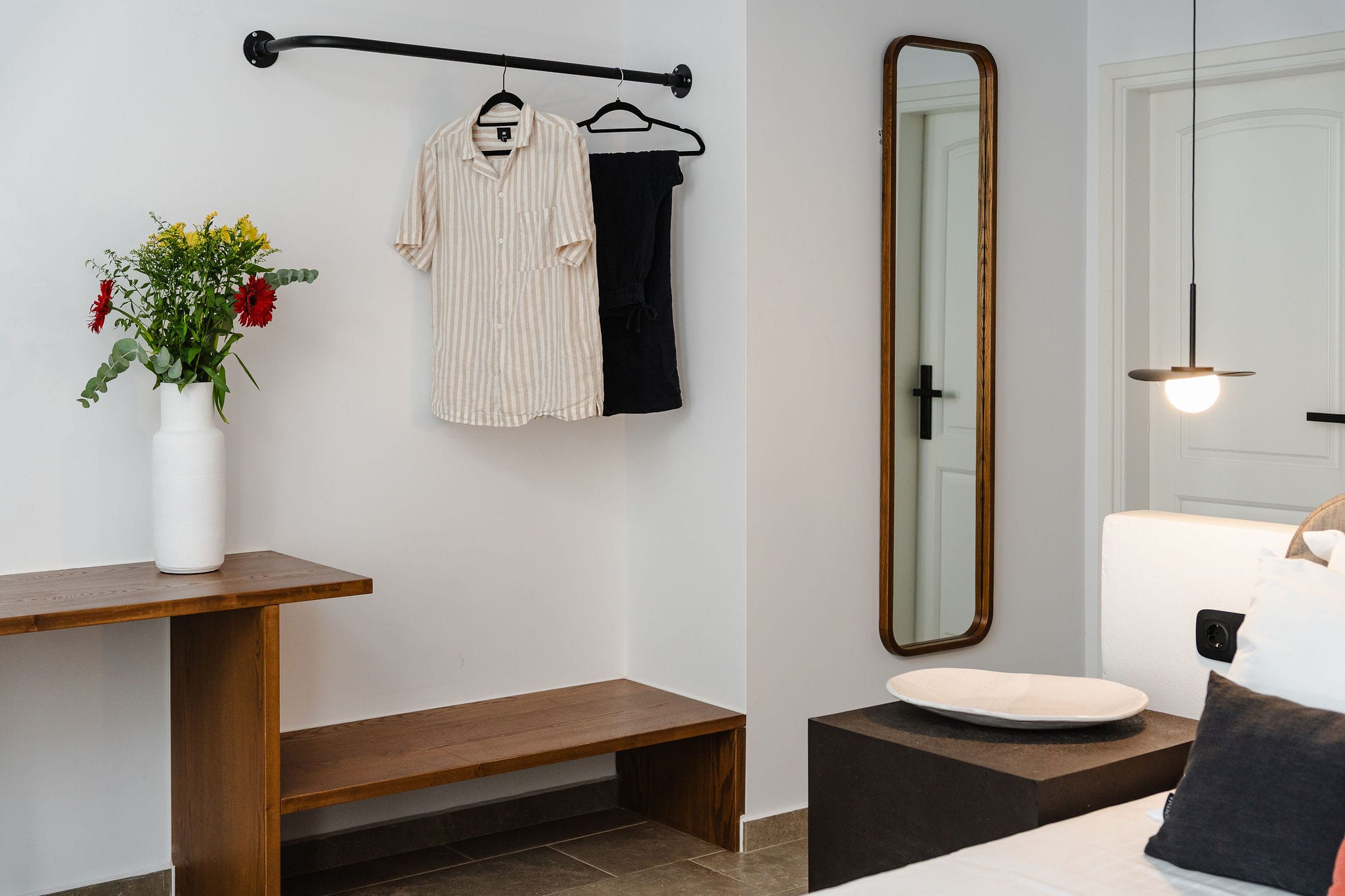 a bathroom with a mirror and a sink