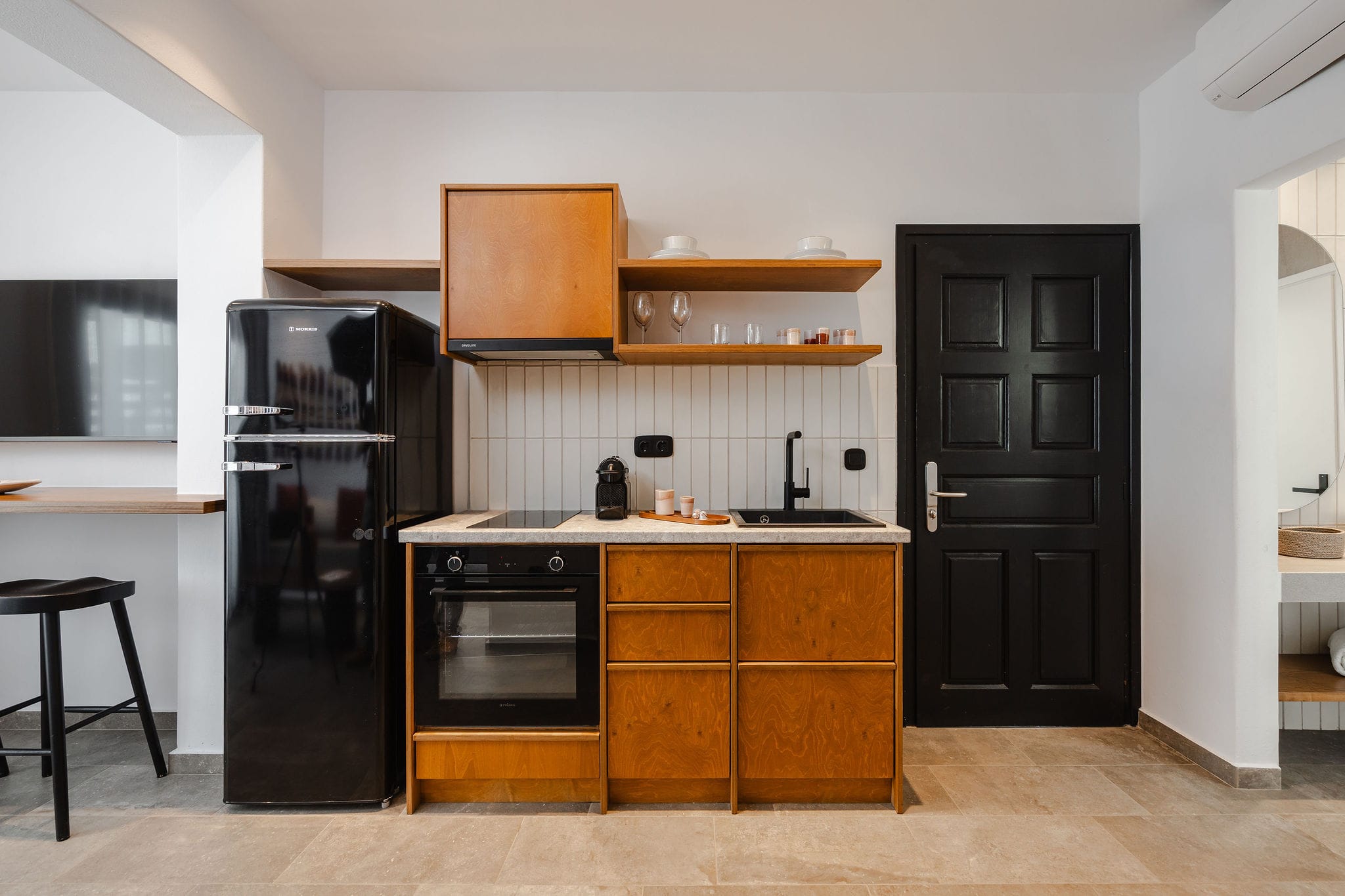 a kitchen with wooden cabinets