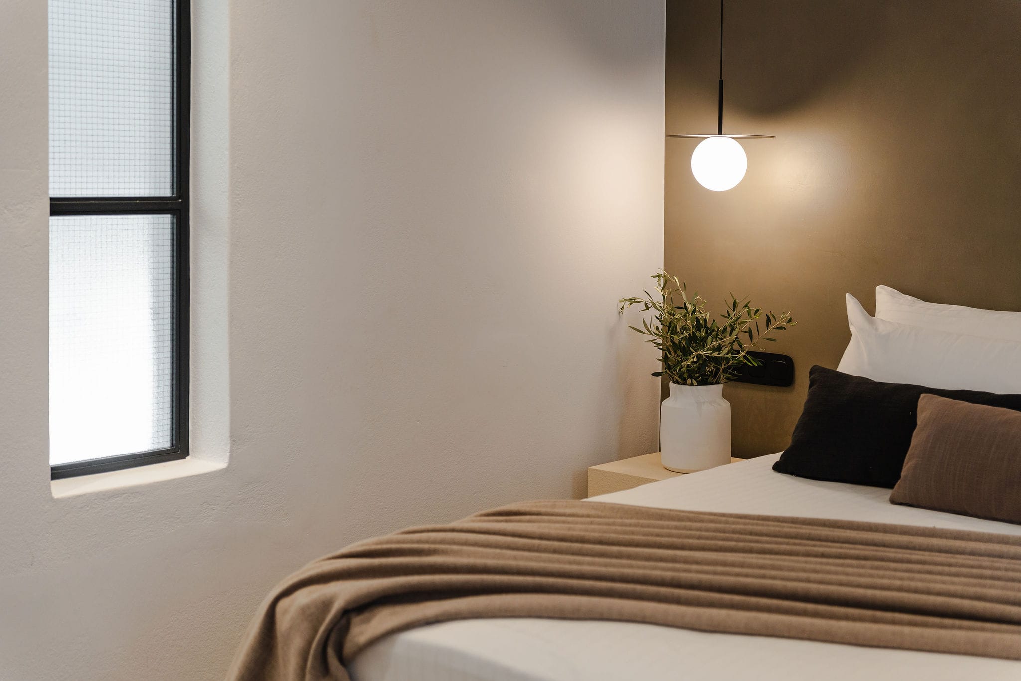 a bed with a plant on it