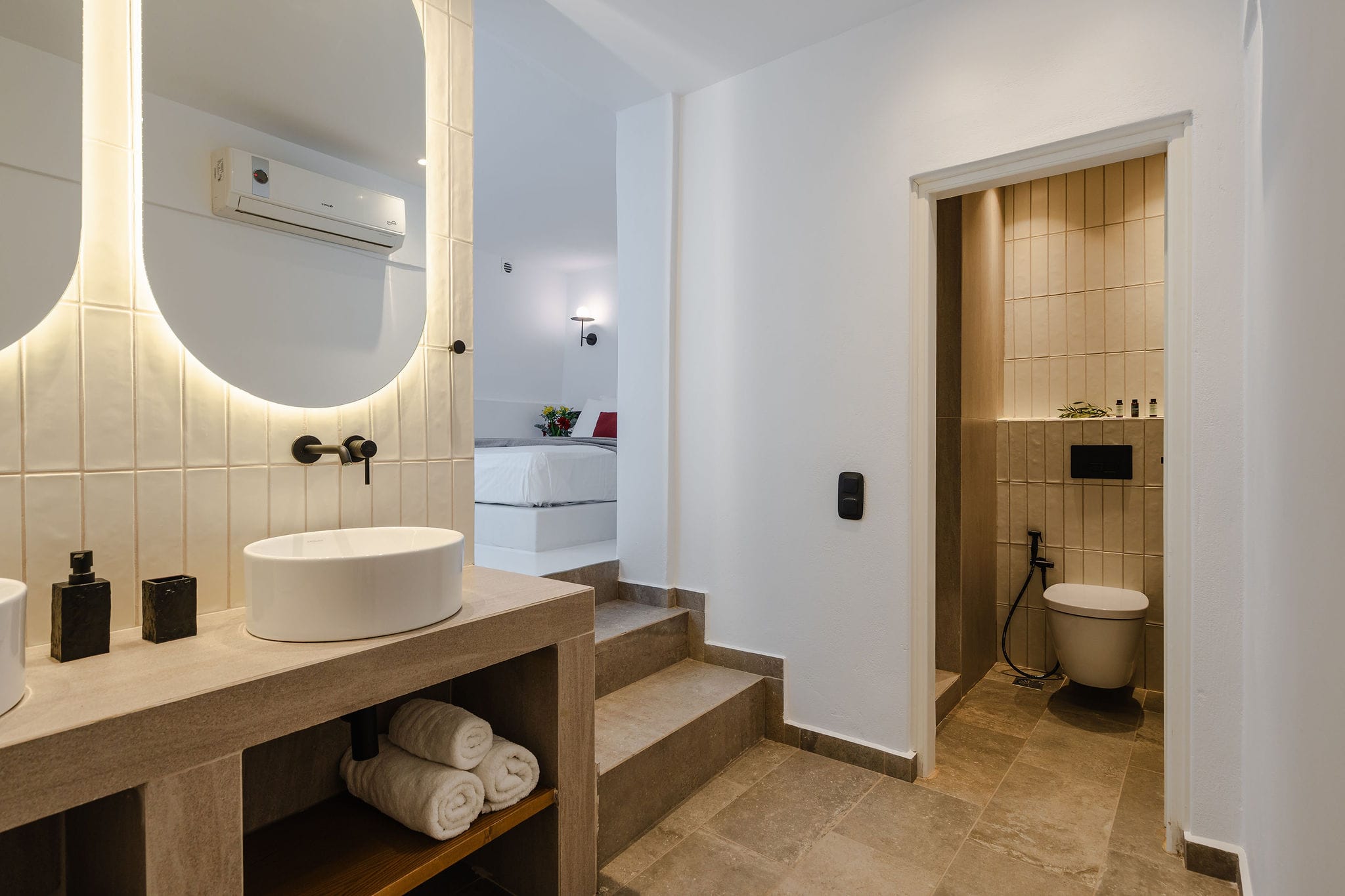 a bathroom with a tub sink and toilet