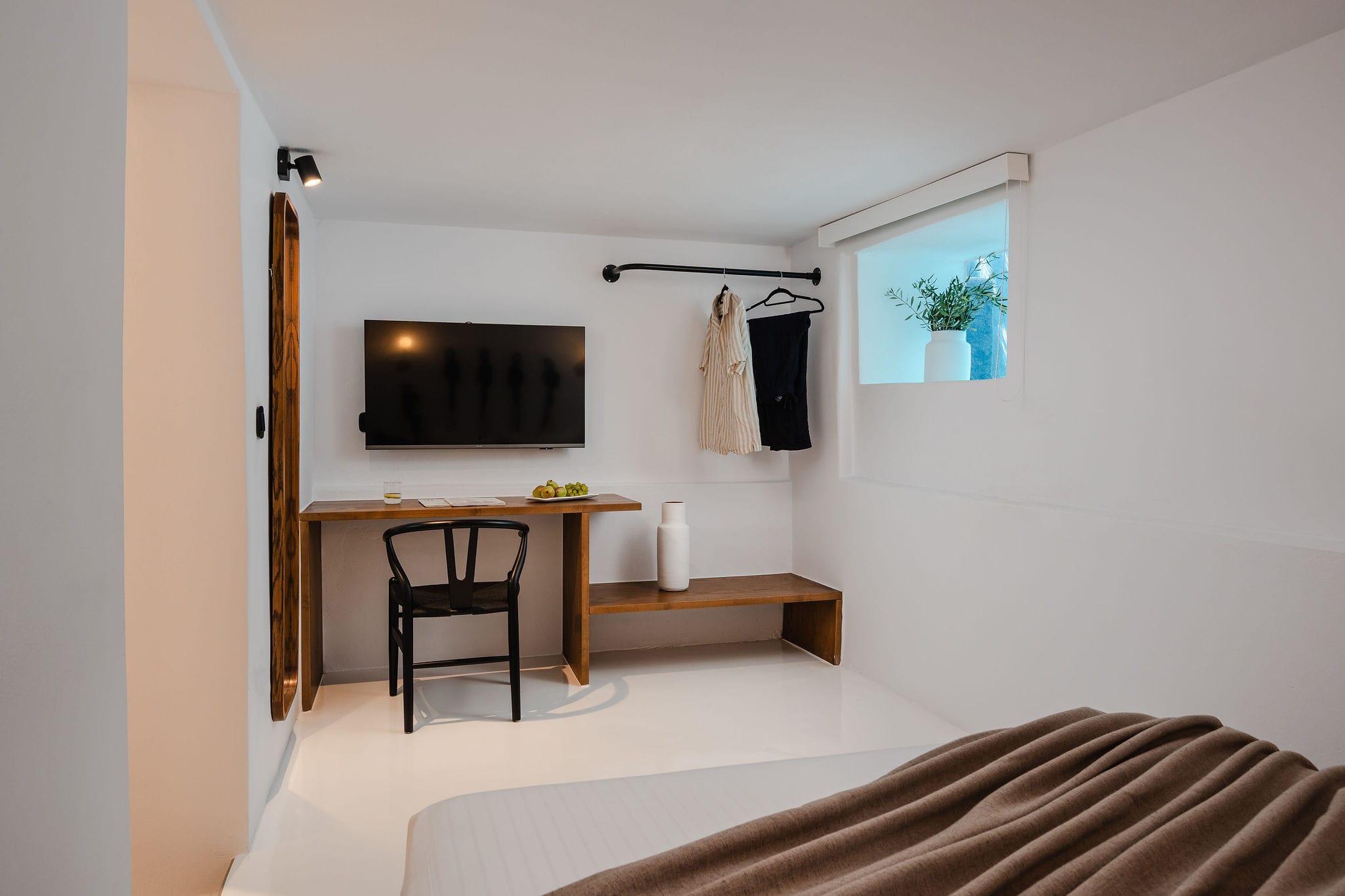 a room with a bed and a desk