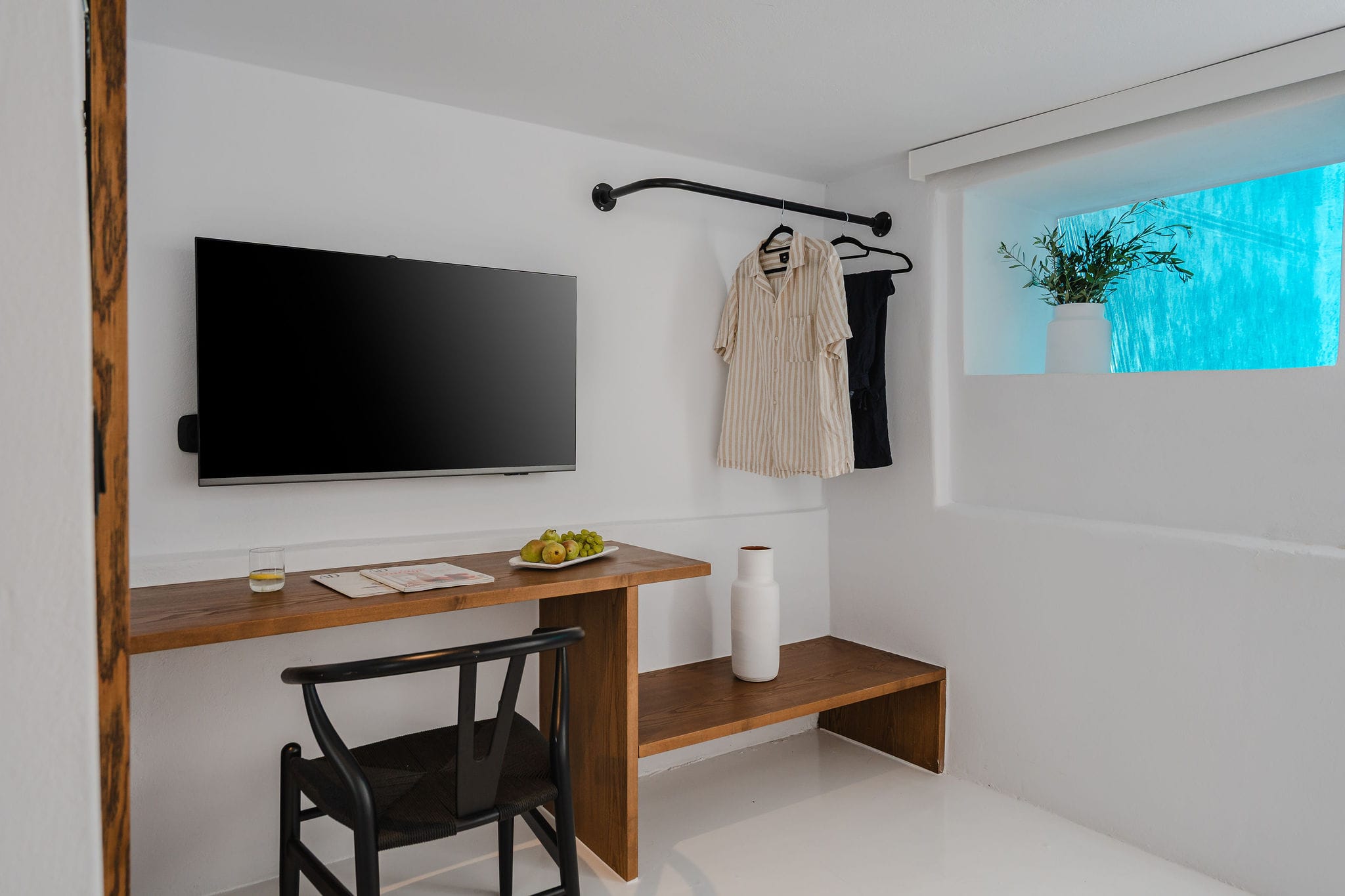 a room with a tv and a table