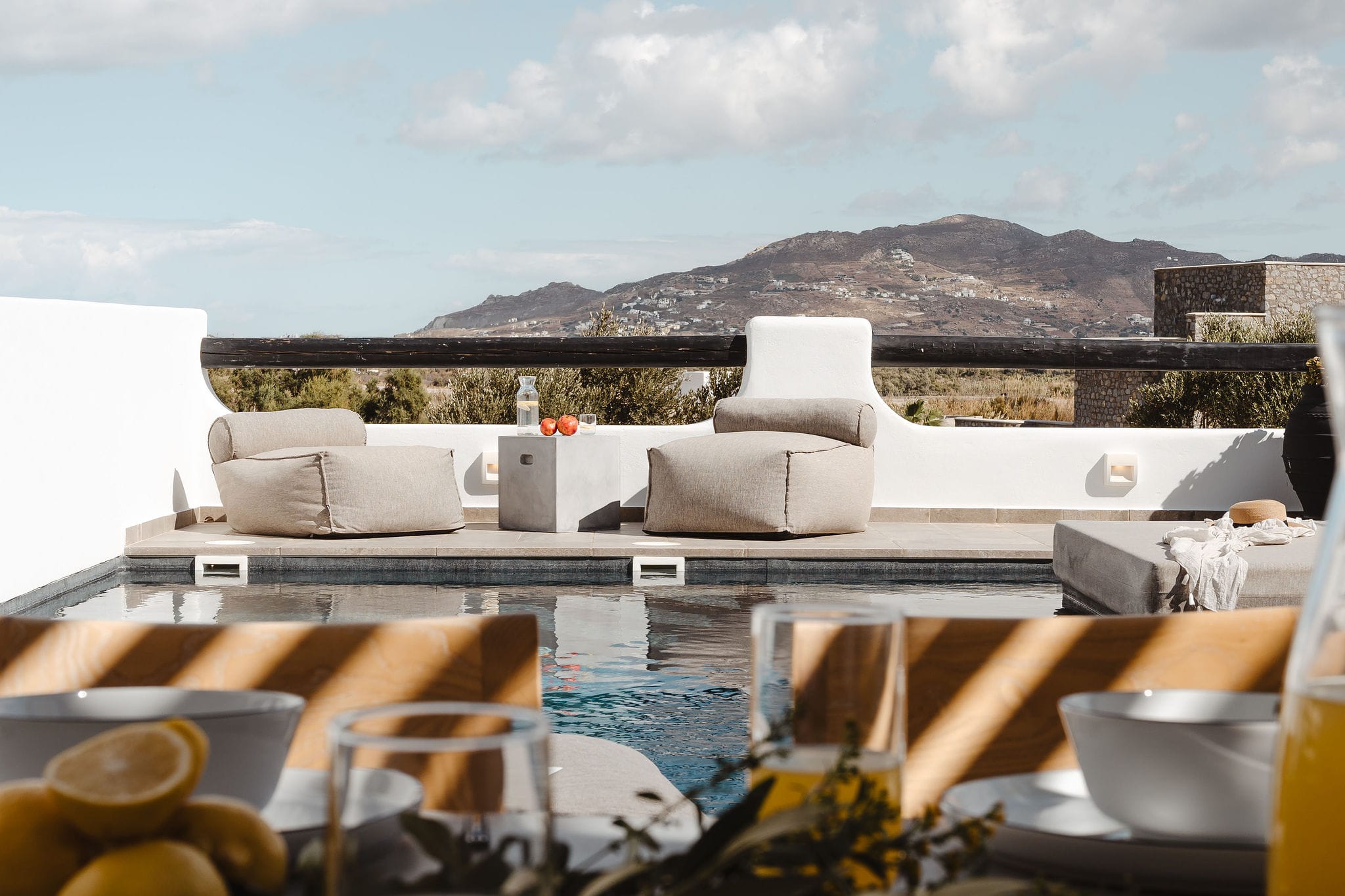 a balcony with a view of the mountains and the ocean