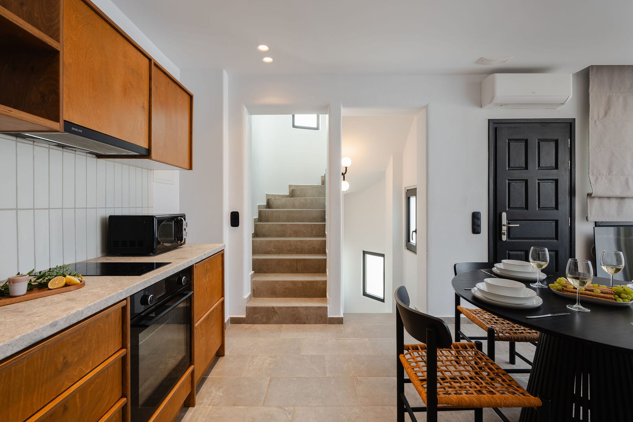 a kitchen with a dining table and oven