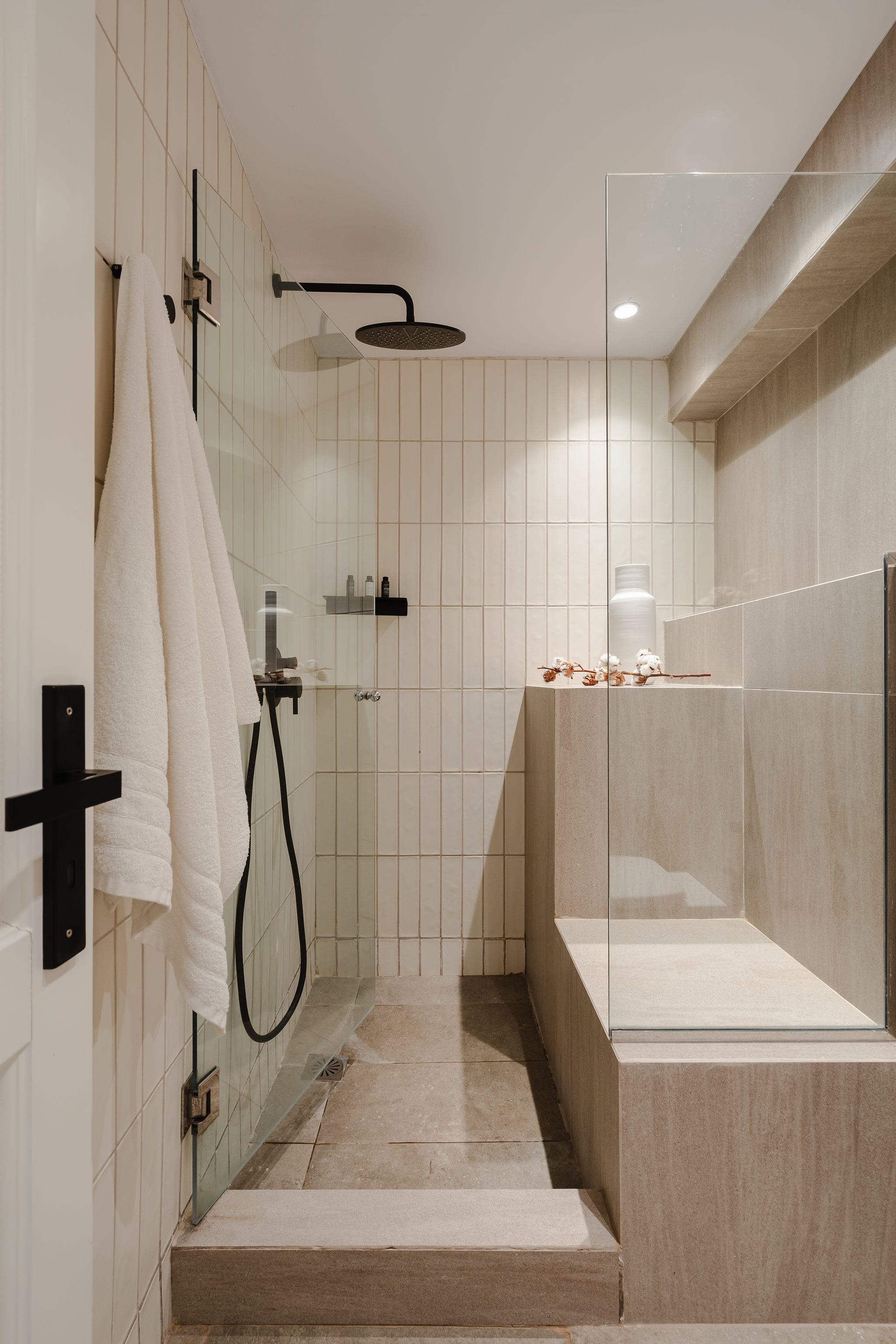 a bathroom with a shower and a bathtub