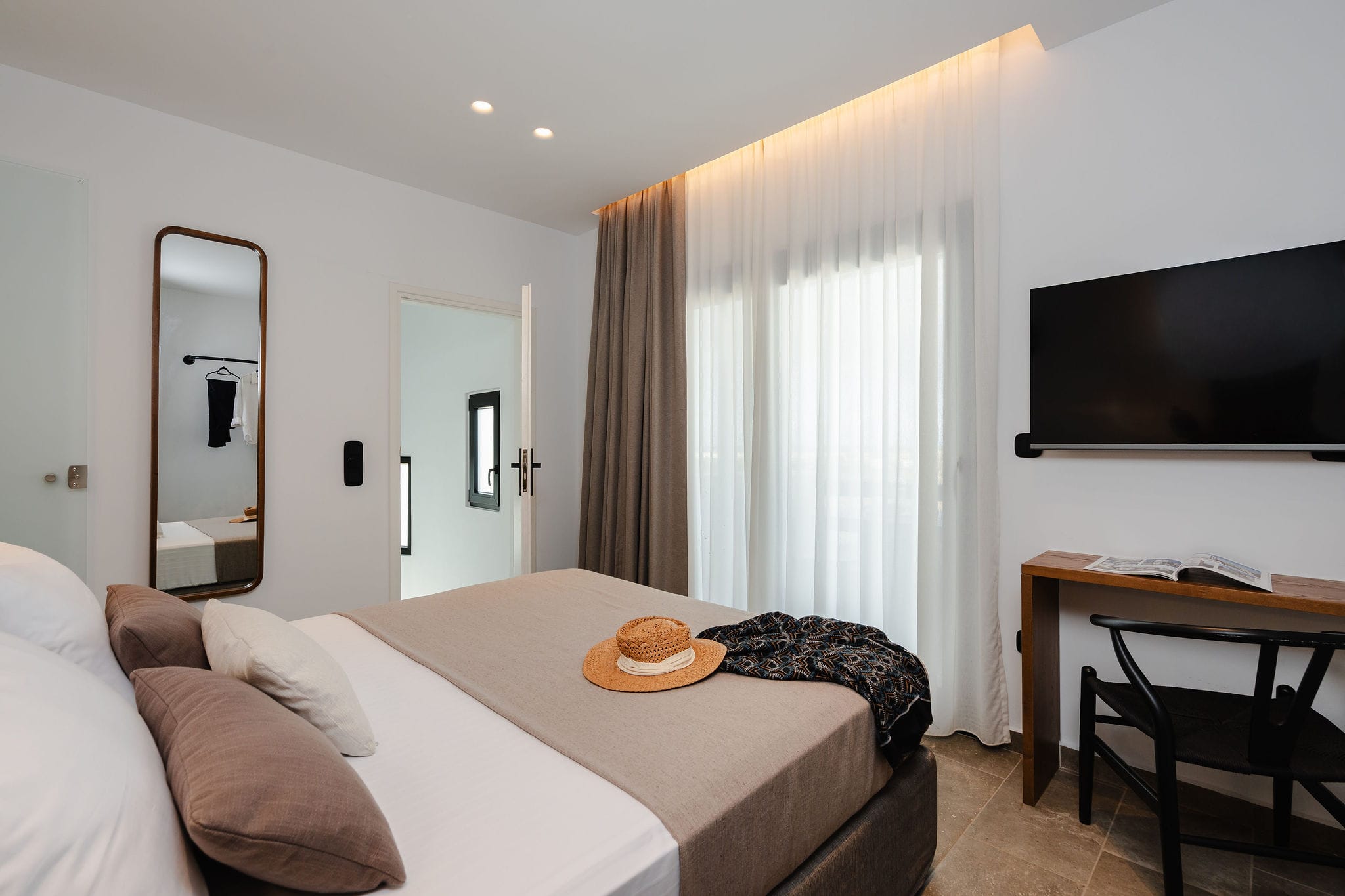 a room with a bed and a tv