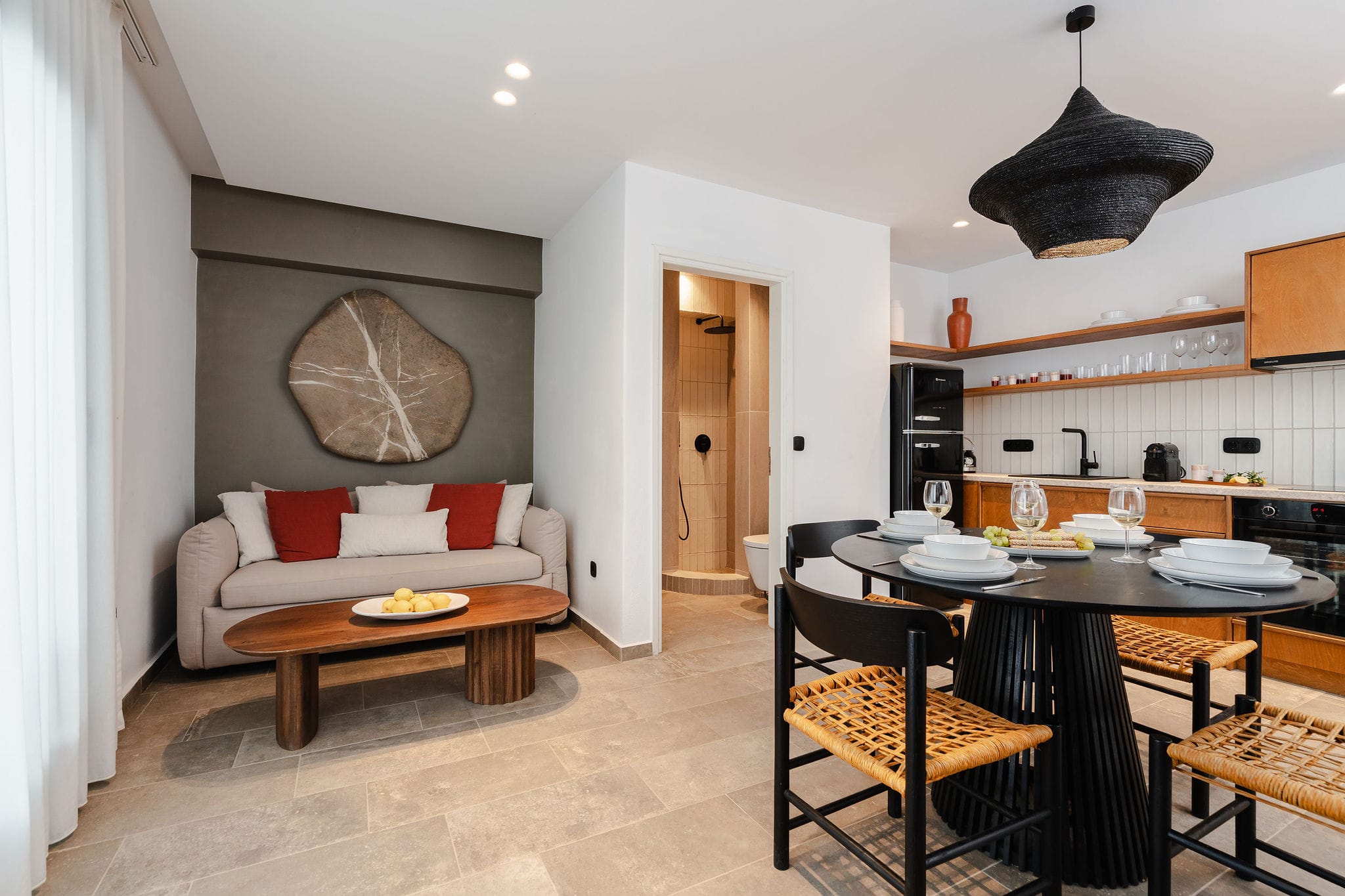 a living room with a couch and dining table