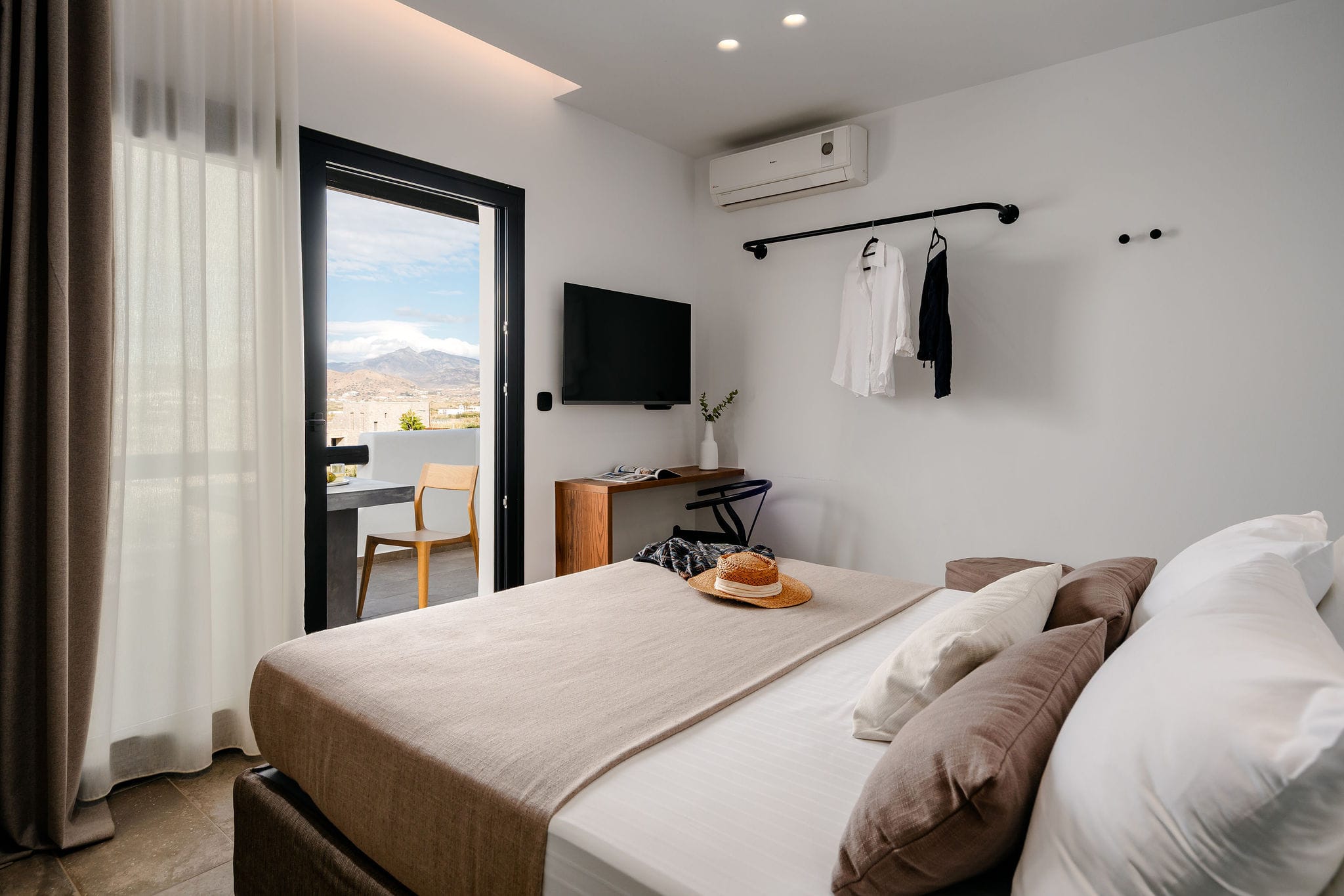 a hotel room with a bed and a tv