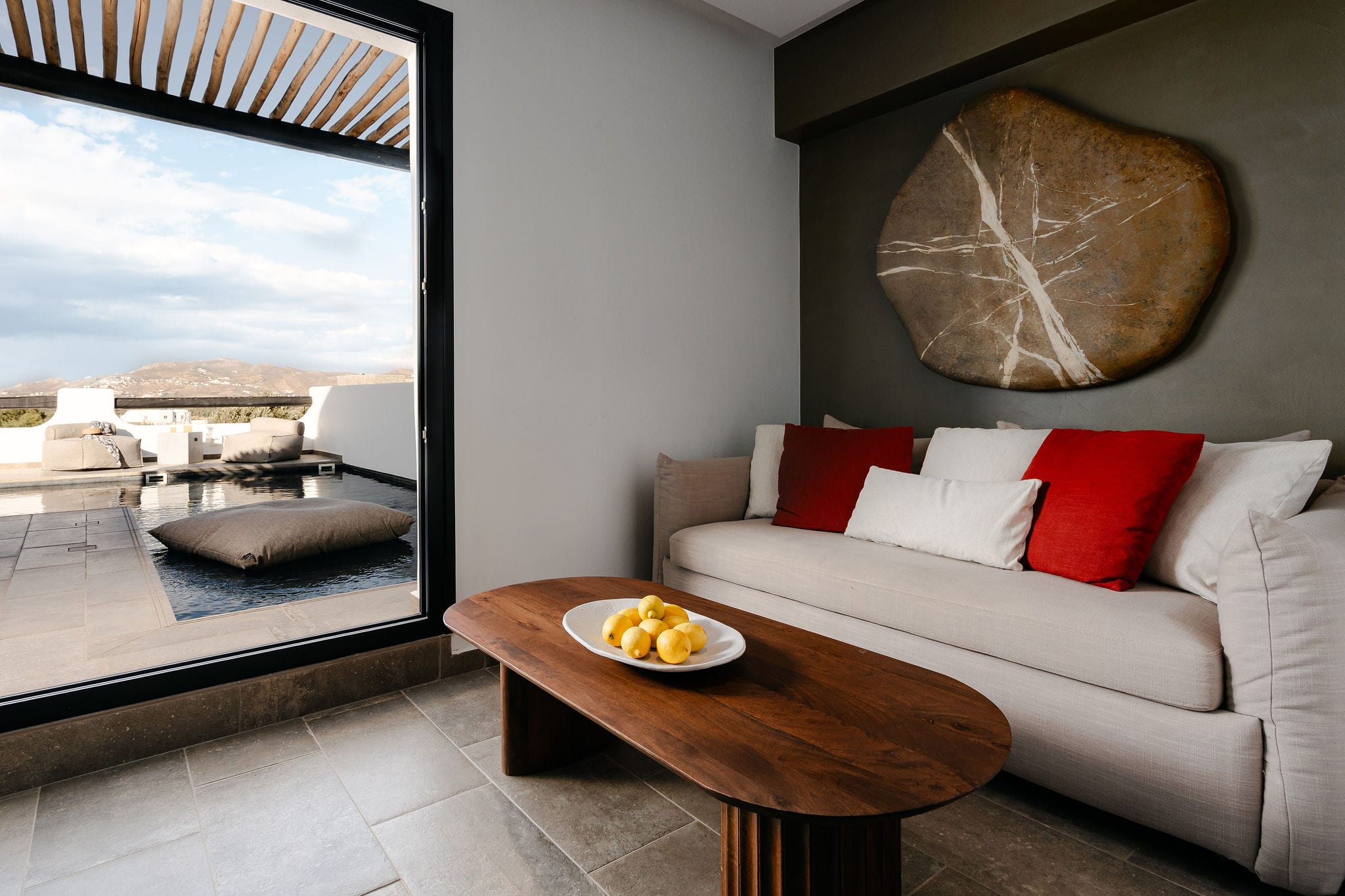 a living room with a couch and a table with a plate of food