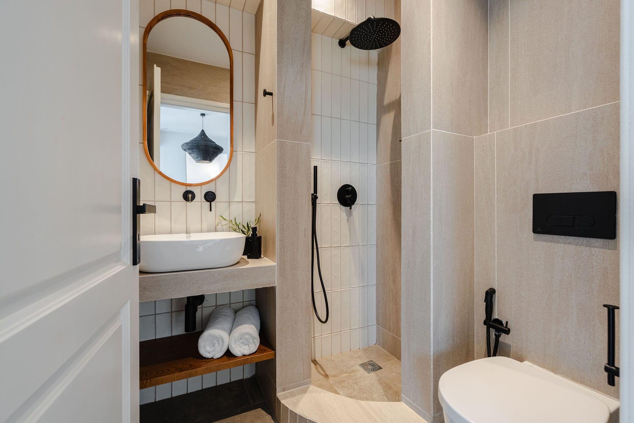 a bathroom with a mirror and sink