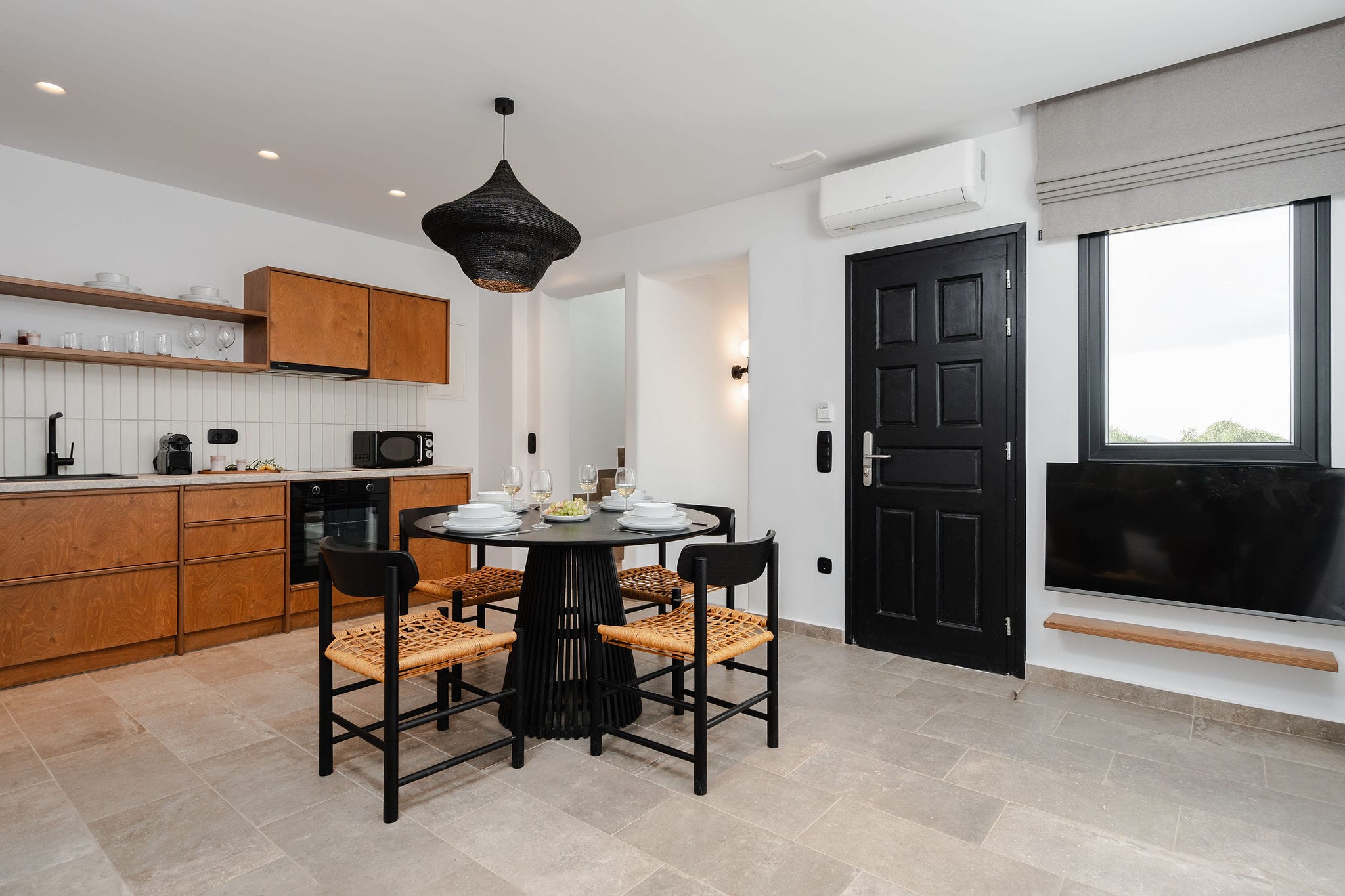 a kitchen with a table and chairs