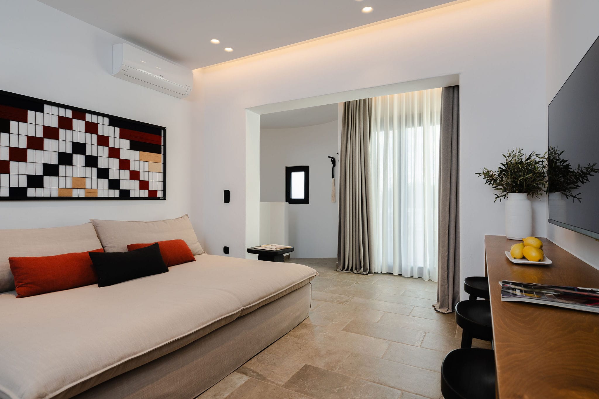 a bedroom with a bed and a table