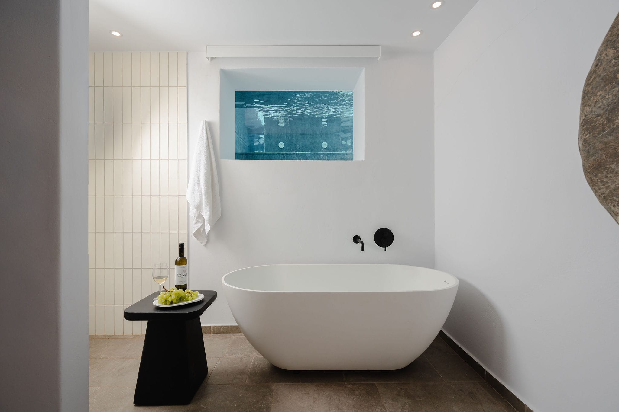 a white bathtub in a bathroom